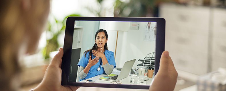 Patient and doctor discussing treatment via telehealth tool.
