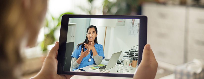 Patient and doctor discussing treatment via telehealth tool.