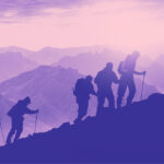 Hikers climbing up mountain