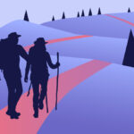 two hikers walking along trail