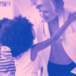 doctor hugging child who is a patient